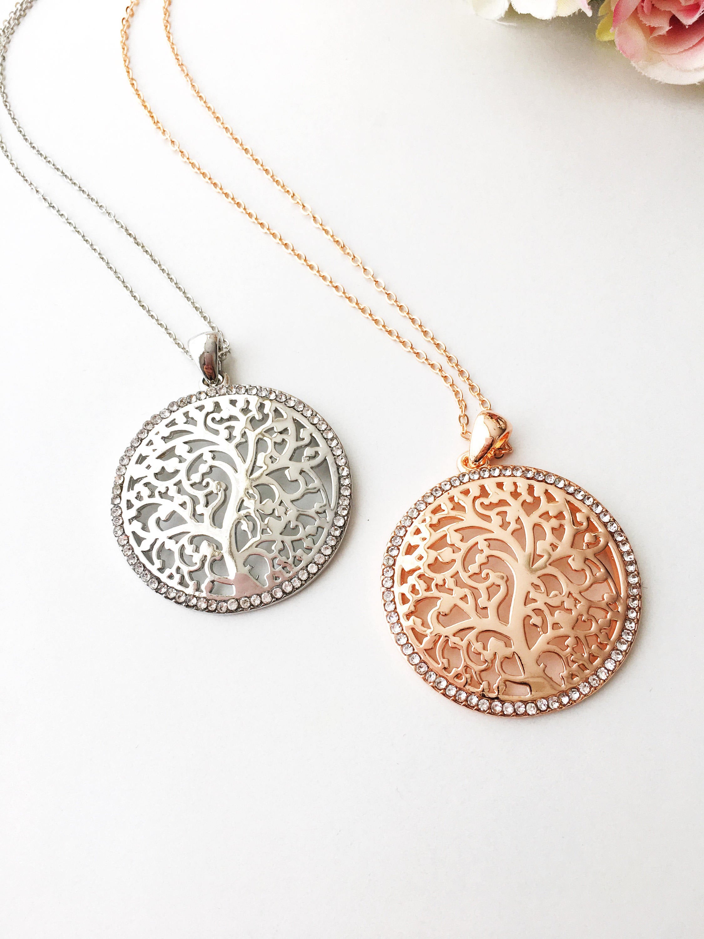 Silver Tree of Life Necklace featuring a detailed charm on a long stainless steel chain, symbolizing family and connection.