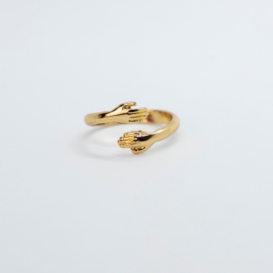 Couple Stackable Love Ring in silver and gold, featuring love hugging hands design, adjustable size for any finger.