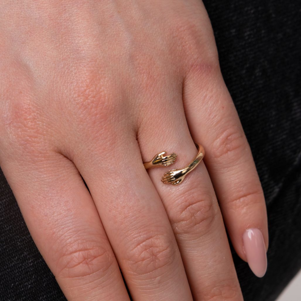 Couple Stackable Love Ring in silver and gold, featuring love hugging hands design, adjustable size for any finger.