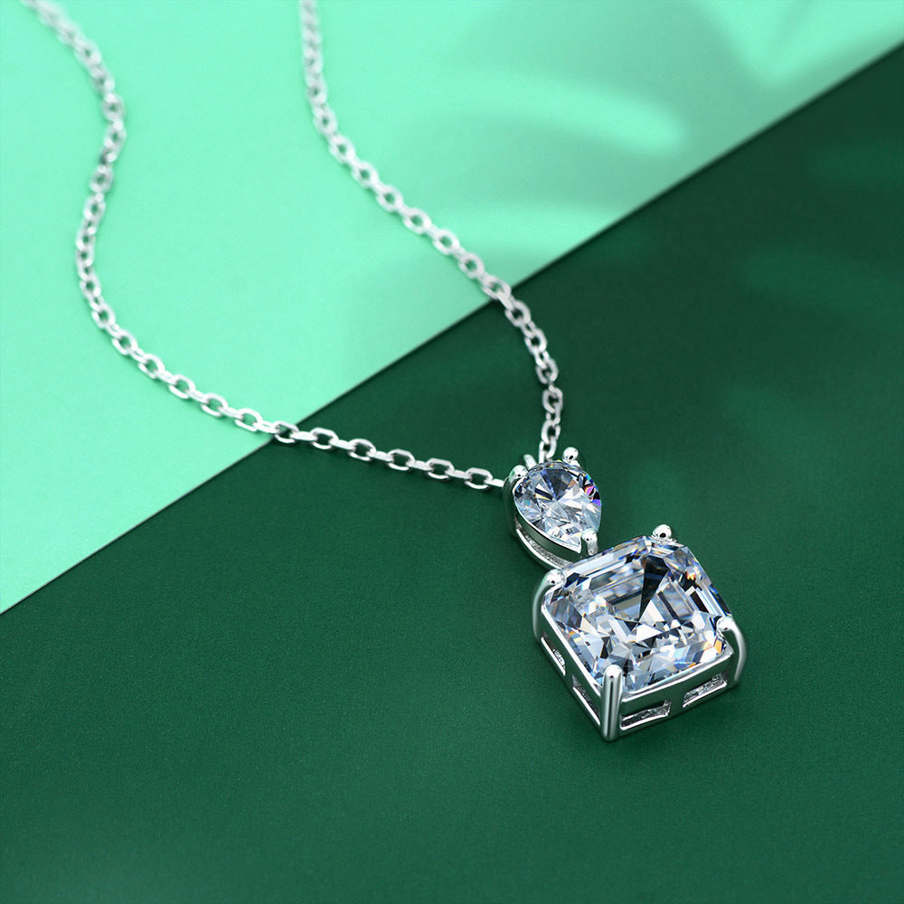 A delicate emerald cut white sapphire necklace made of 925 sterling silver with real white gold filling, featuring an adjustable chain.