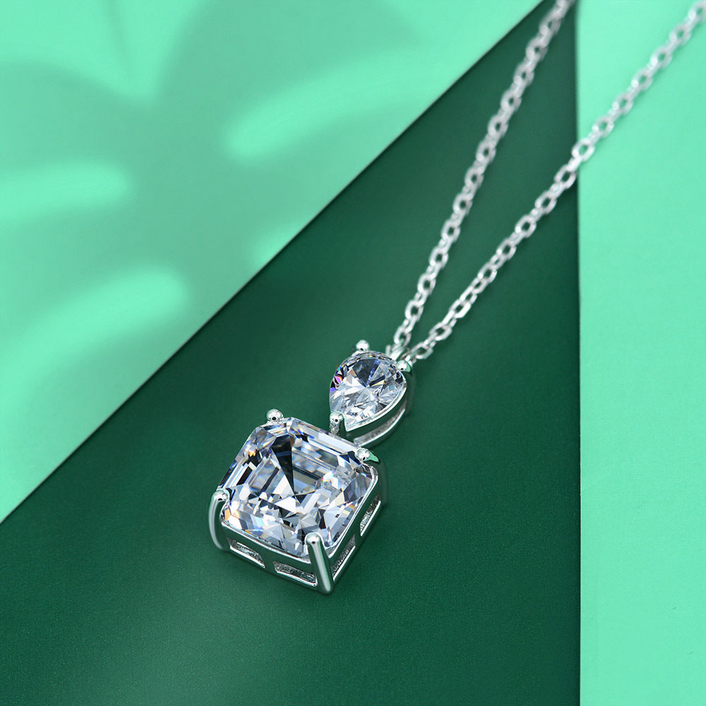 A delicate emerald cut white sapphire necklace made of 925 sterling silver with real white gold filling, featuring an adjustable chain.