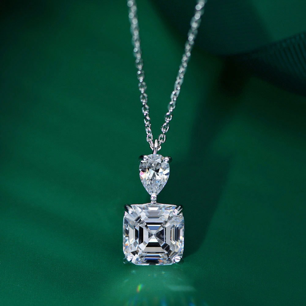 A delicate emerald cut white sapphire necklace made of 925 sterling silver with real white gold filling, featuring an adjustable chain.