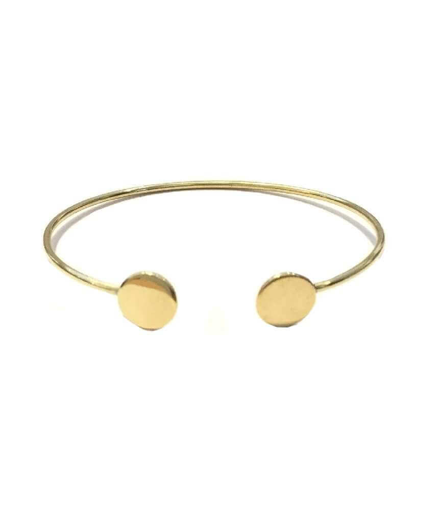 A simple geometric bracelet in gold and silver, showcasing its adjustable design and elegant craftsmanship.