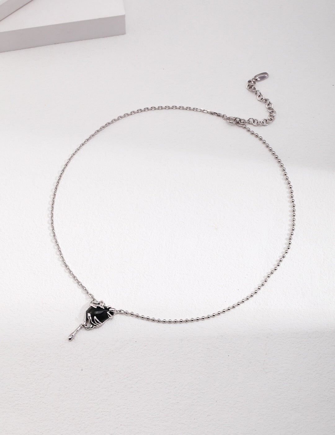 A handmade Simple Vintage Black Agate Necklace featuring a black agate pendant and gold vermeil chain, elegantly displayed on a soft background.