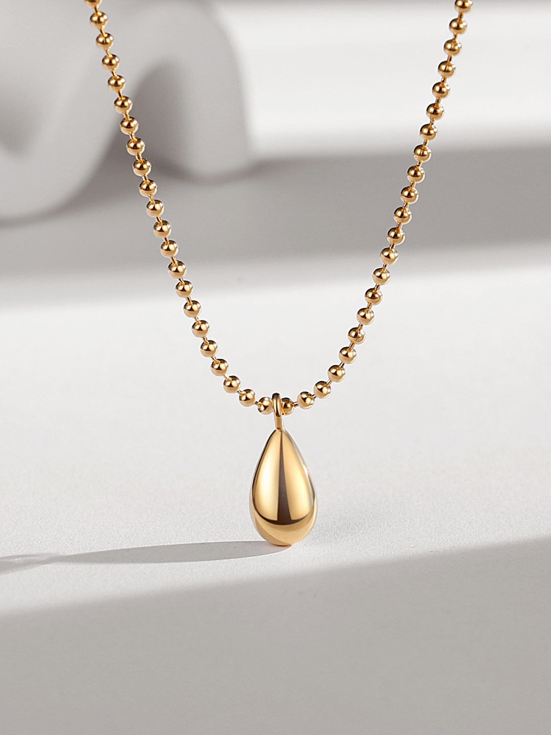 Elegant Simple Water Drop Pendant Necklace made of gold vermeil, featuring a delicate water drop design.