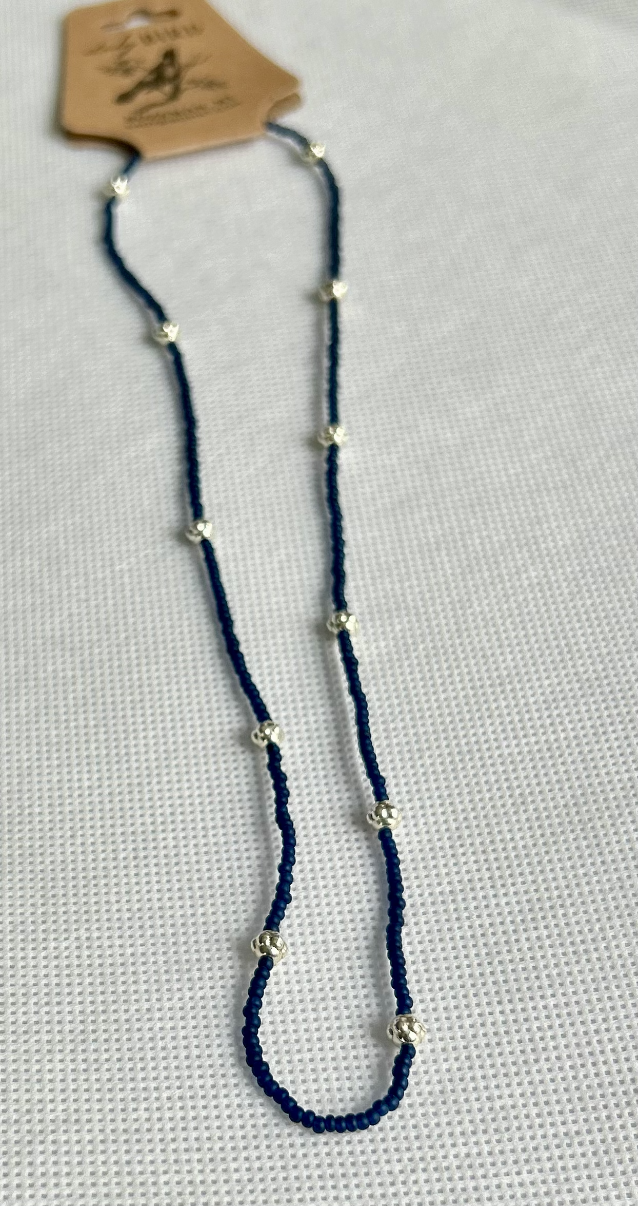 Simply Delicate Navy Blue Seed Bead Stretchy Necklace featuring chunky gold metallic accents, showcasing a stylish Boho design.