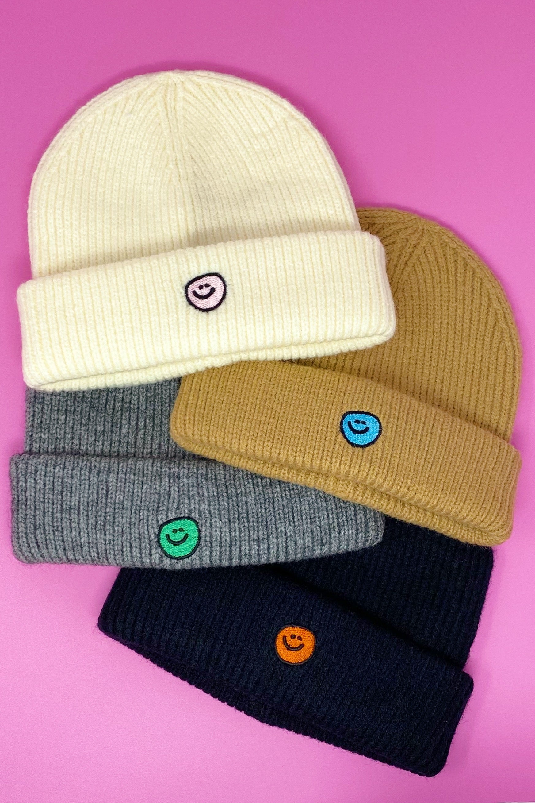 Simply Smile Beanie featuring a small happy face embroidery, made of soft acrylic material.