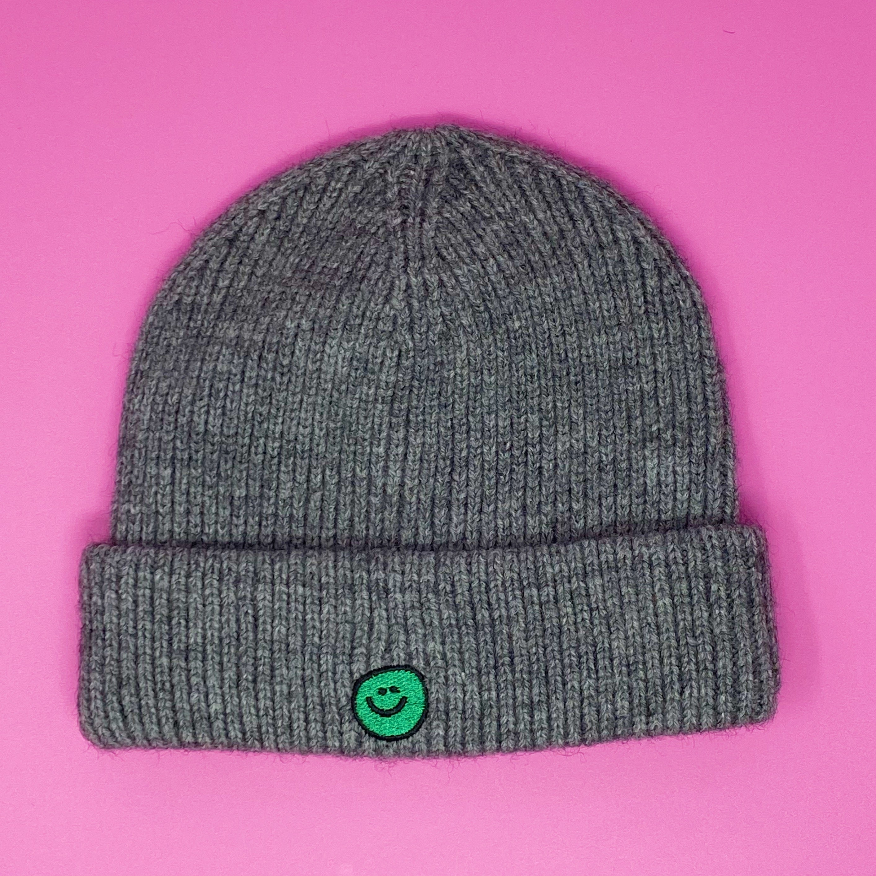 Simply Smile Beanie featuring a small happy face embroidery, made of soft acrylic material.