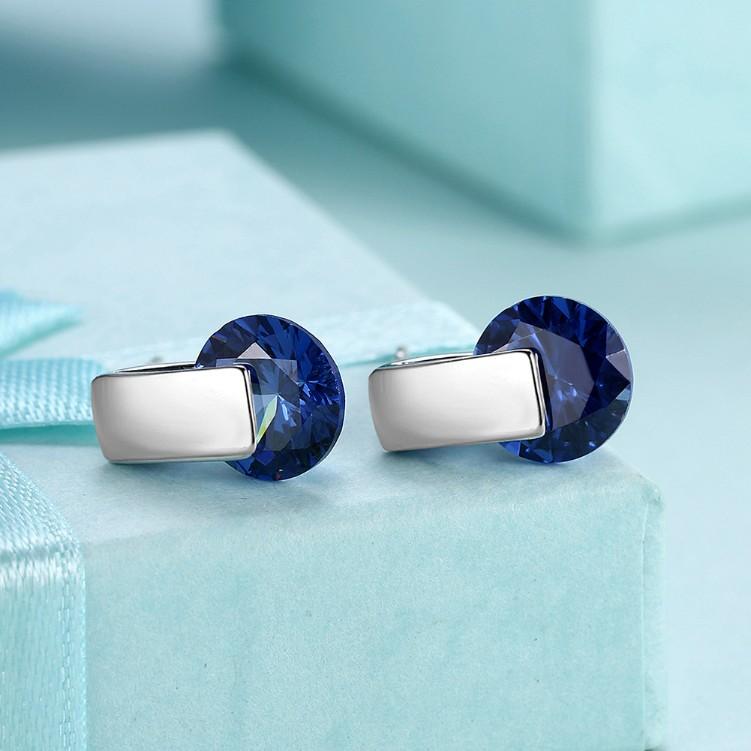 A pair of elegant Simulated Sapphire Sleek Bar Earrings set in 18K white gold, showcasing their stunning design and craftsmanship.