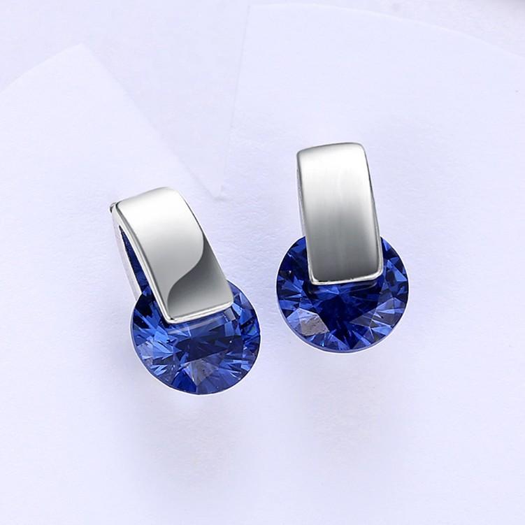 A pair of elegant Simulated Sapphire Sleek Bar Earrings set in 18K white gold, showcasing their stunning design and craftsmanship.