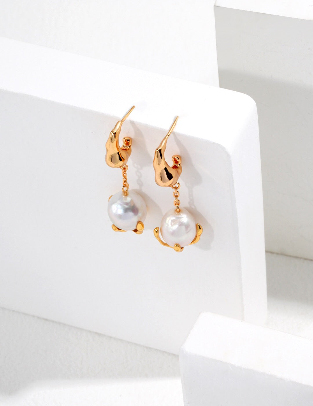 Elegant Single Dangle Teardrop Pearl Earrings featuring natural pearls and sterling silver, perfect for any occasion.