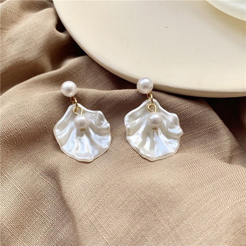 A pair of elegant short earrings featuring a unique shell design adorned with artificial pearls, made from alloy and S925 material.