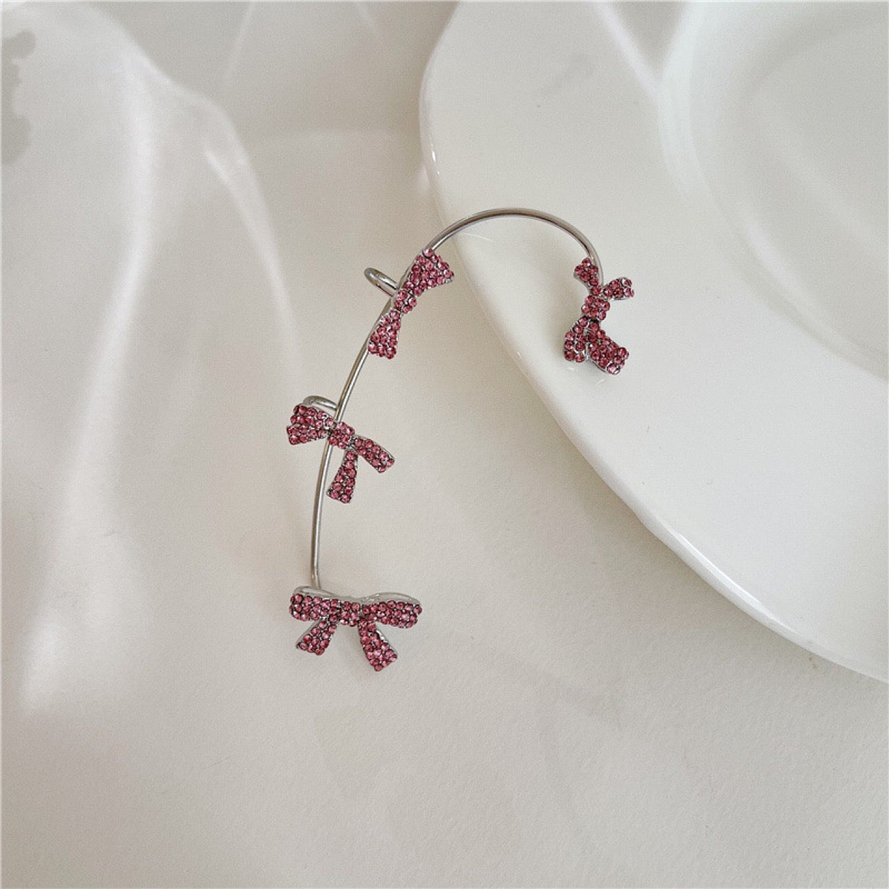 Single Various Bowknot Ear-Hook made of alloy and rhinestones, showcasing an elegant bowknot design.