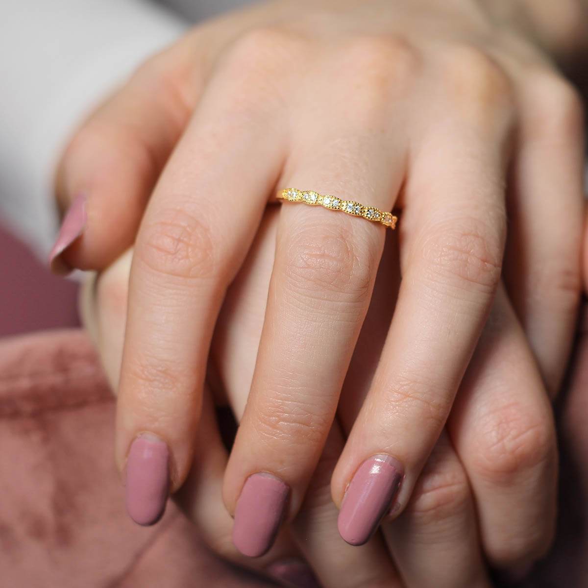 A close-up of the Skinny ultra slim stacking pave ring featuring round brilliant cut sparkles and milgrain edge detail.