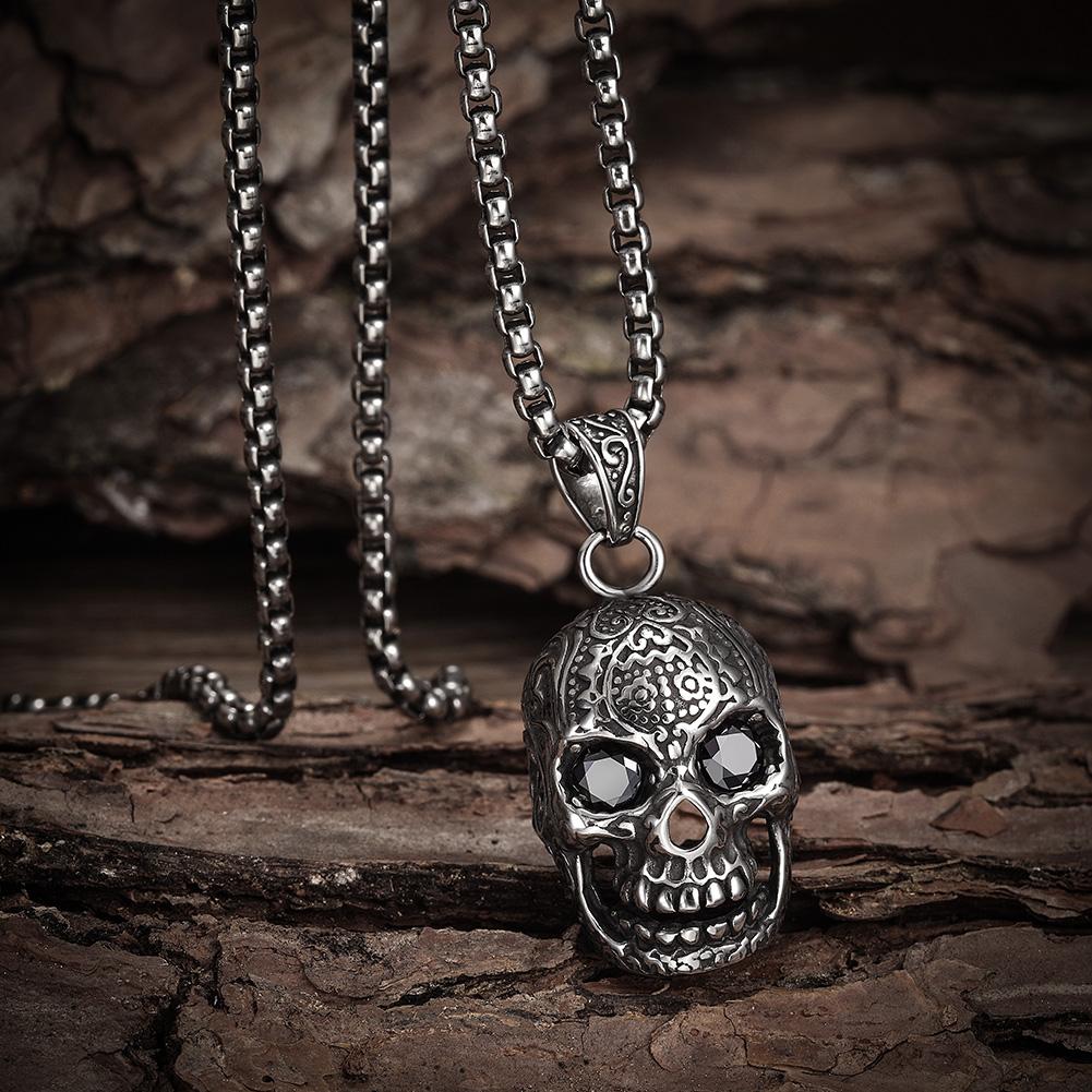 A stylish skull pendant necklace made of 316L surgical stainless steel with a 14K gold PVD plated finish, showcasing intricate details.