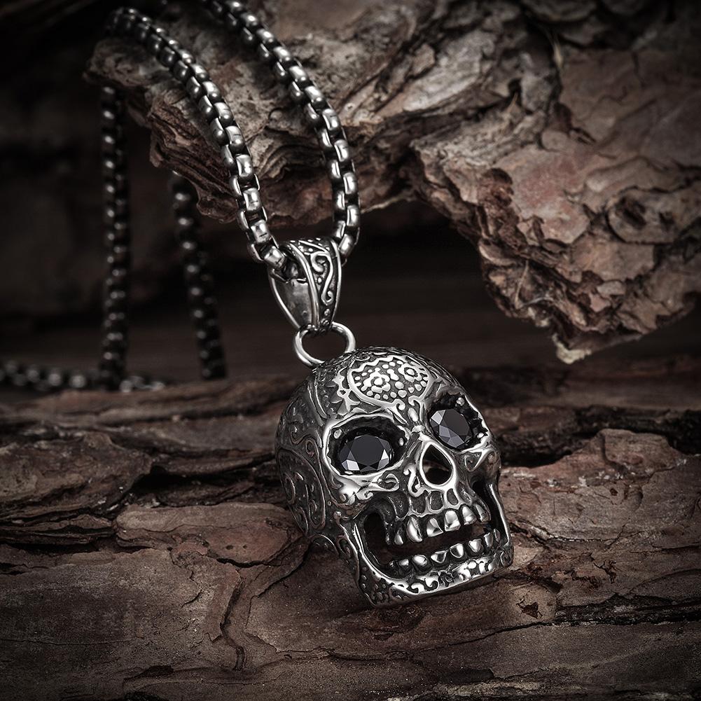 A stylish skull pendant necklace made of 316L surgical stainless steel with a 14K gold PVD plated finish, showcasing intricate details.