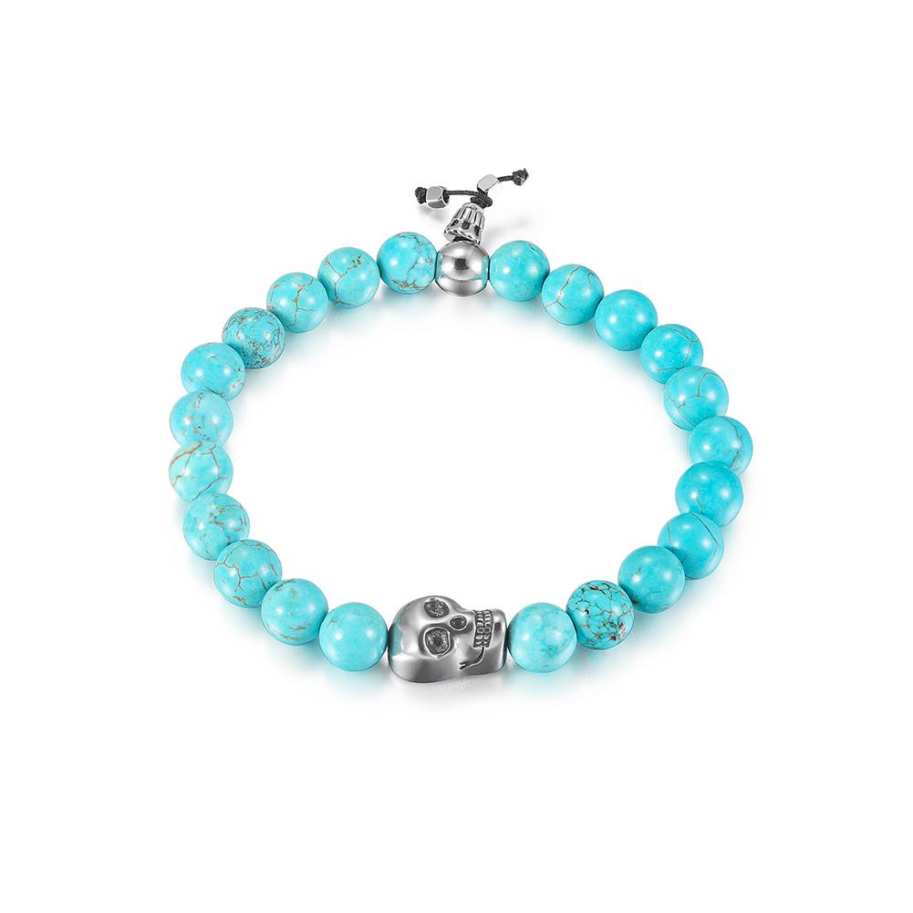 A stylish Skull Turquoise Bead Stretch Bracelet featuring skull motifs and vibrant turquoise beads on a flexible band.