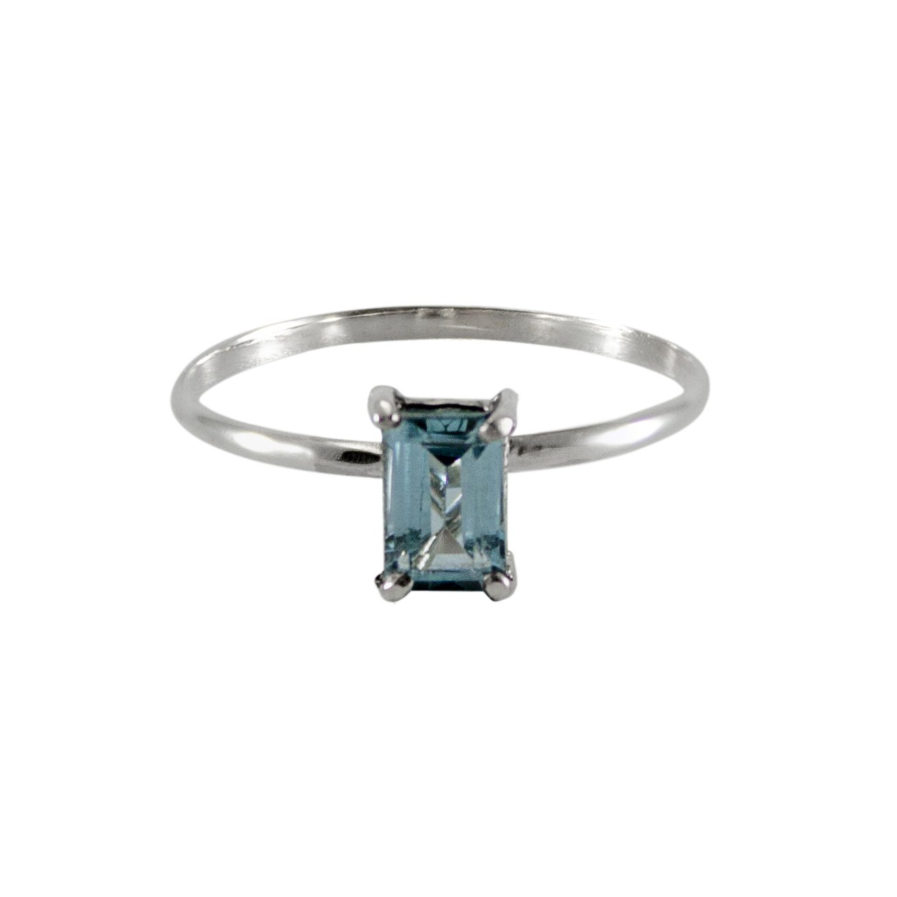 Sky Blue Topaz Four Prong Solitaire Ring in sterling silver, showcasing a vibrant blue gemstone set in a delicate band.