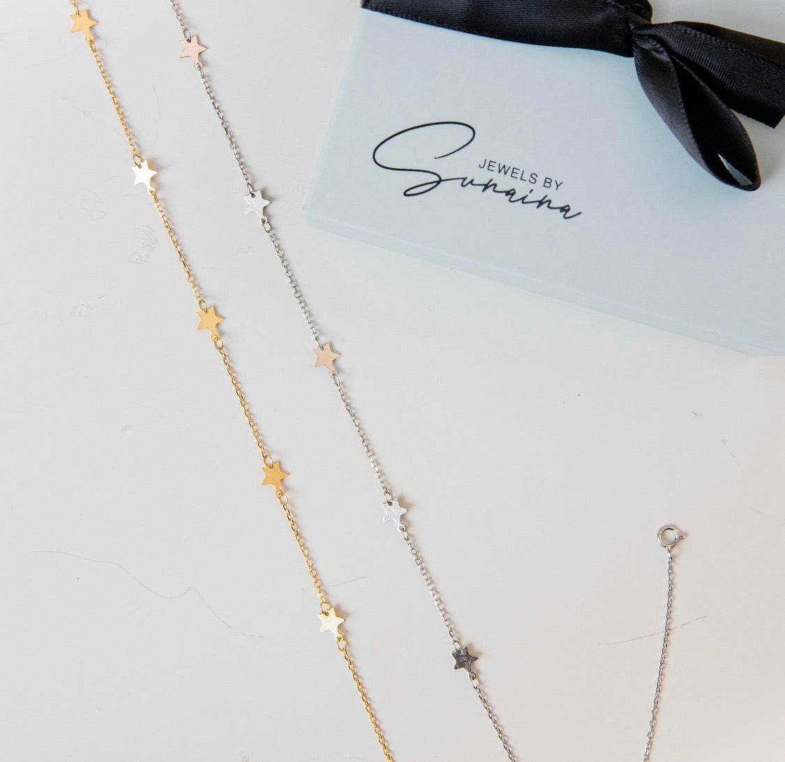 SKYLA Star Necklace featuring petite star charms on a delicate 925 Sterling Silver chain with 18K Gold Plating.