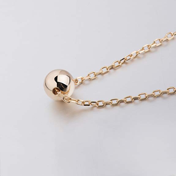 Sleek Sphere Circular Minimalist Pendant Necklace in 14K Gold Plating with cubic zirconia stone, displayed elegantly on a white background.