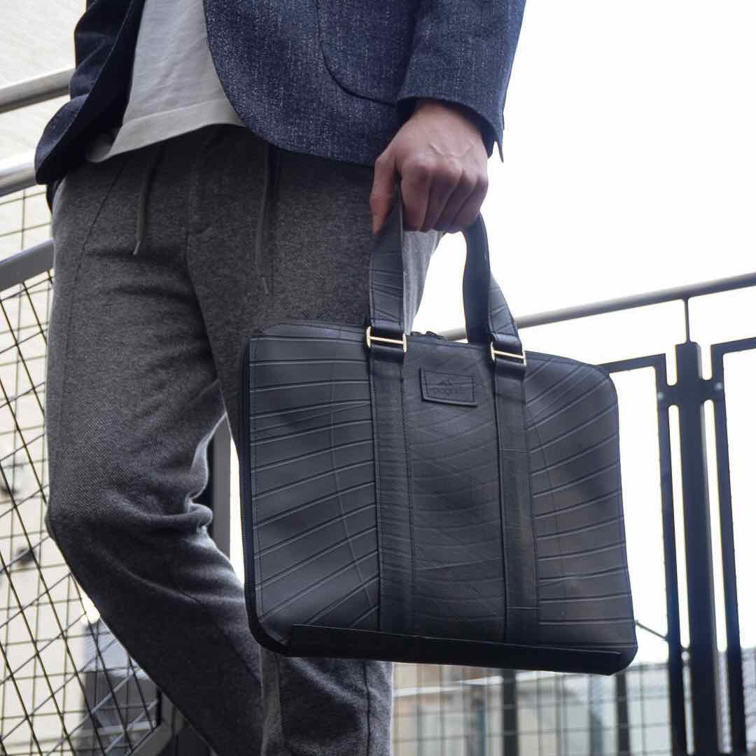 Eco-friendly Slimline Inner Tube Padded Laptop Bag with unique tread patterns, suitable for 13-inch laptops.