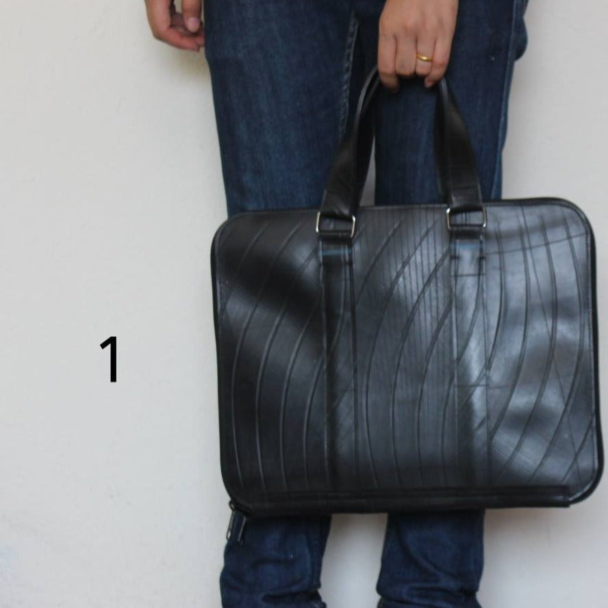 Eco-friendly Slimline Inner Tube Padded Laptop Bag with unique tread patterns, suitable for 13-inch laptops.