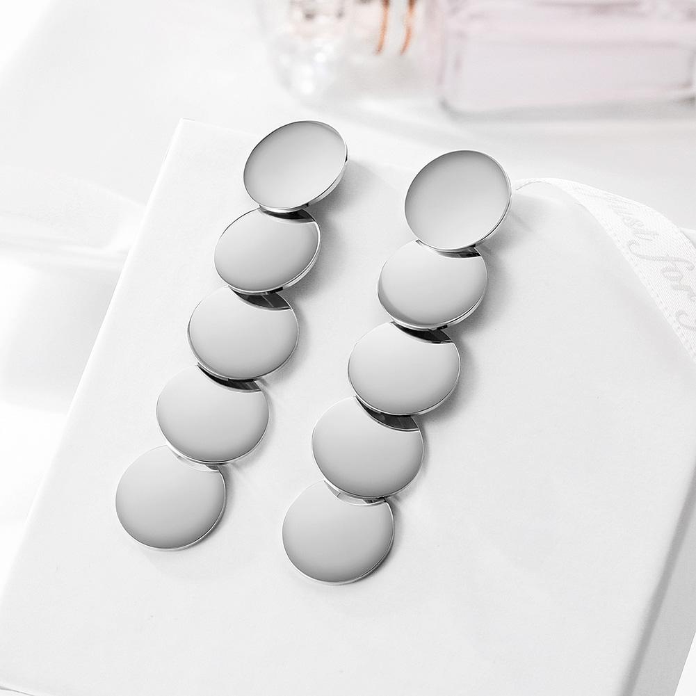 Elegant Small Discs Linear Earrings made of stainless steel with gold plating, showcasing a modern design.