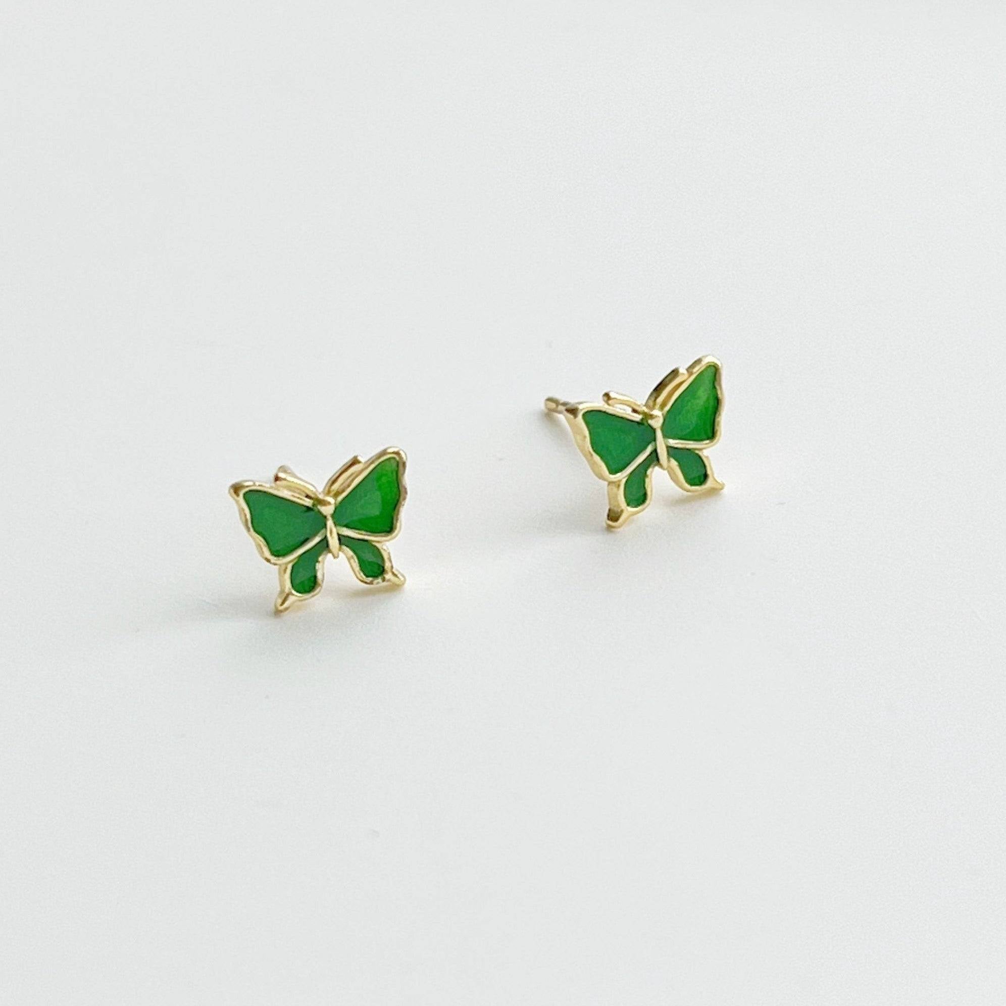 Small emerald green butterfly earrings made from hypoallergenic sterling silver, featuring intricate detailing and a vibrant color.