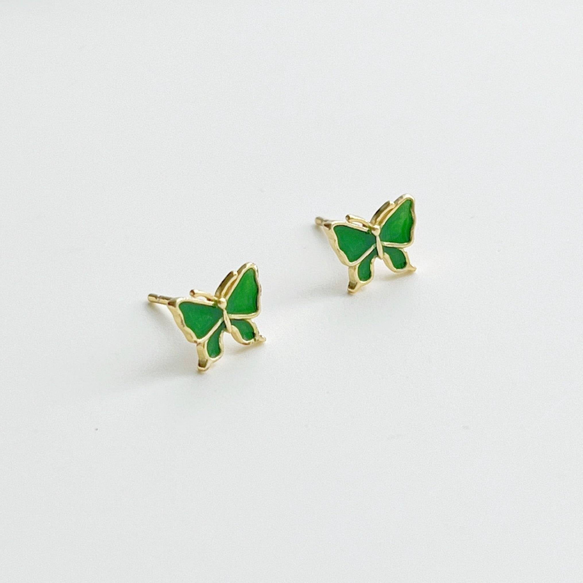 Small emerald green butterfly earrings made from hypoallergenic sterling silver, featuring intricate detailing and a vibrant color.