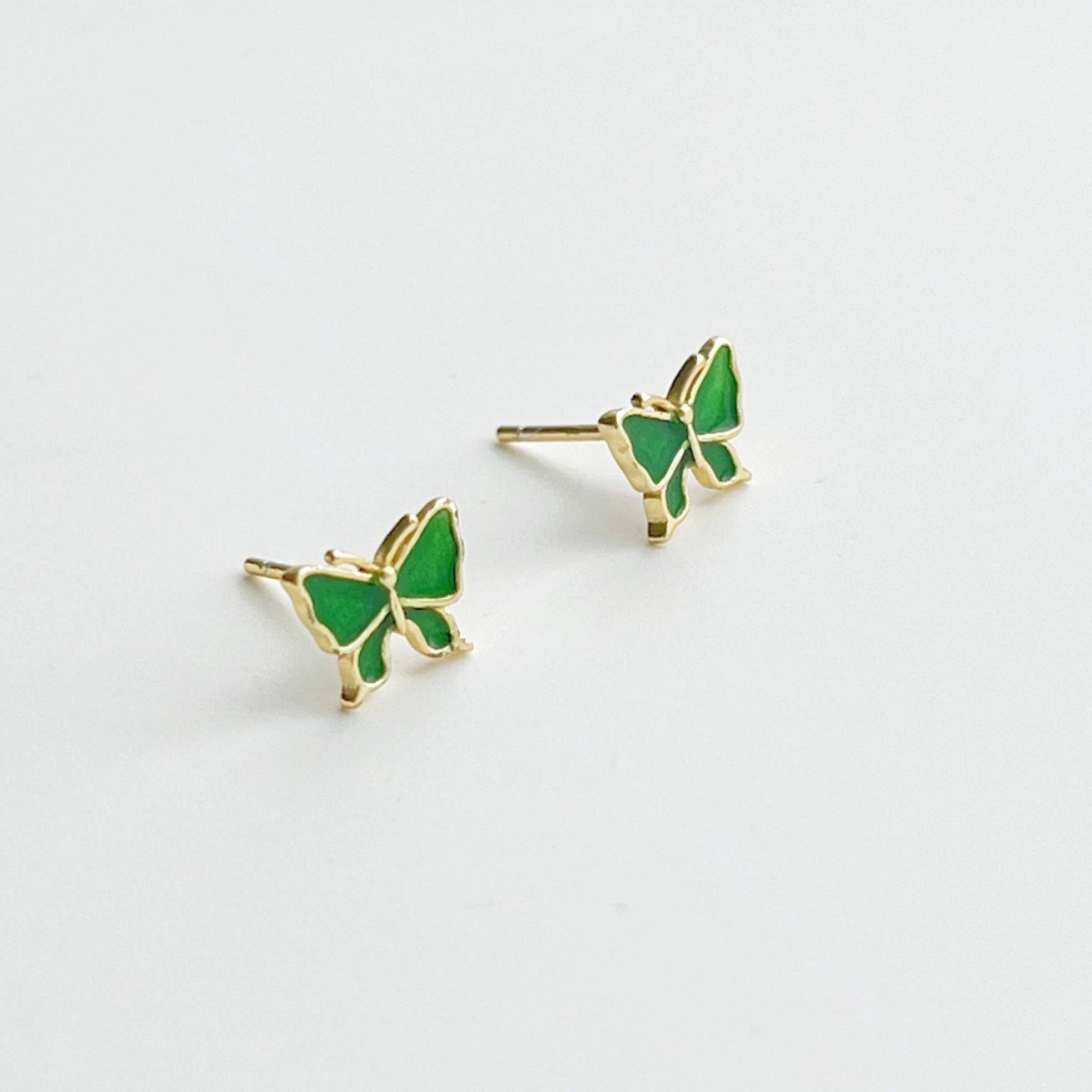 Small emerald green butterfly earrings made from hypoallergenic sterling silver, featuring intricate detailing and a vibrant color.