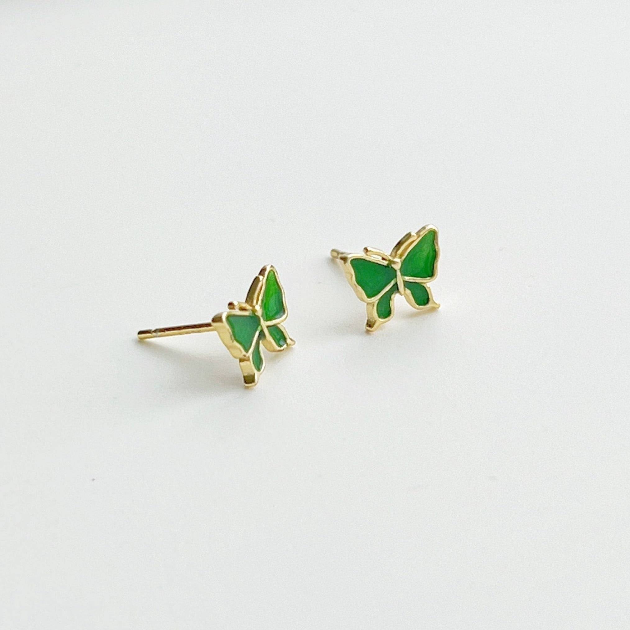 Small emerald green butterfly earrings made from hypoallergenic sterling silver, featuring intricate detailing and a vibrant color.