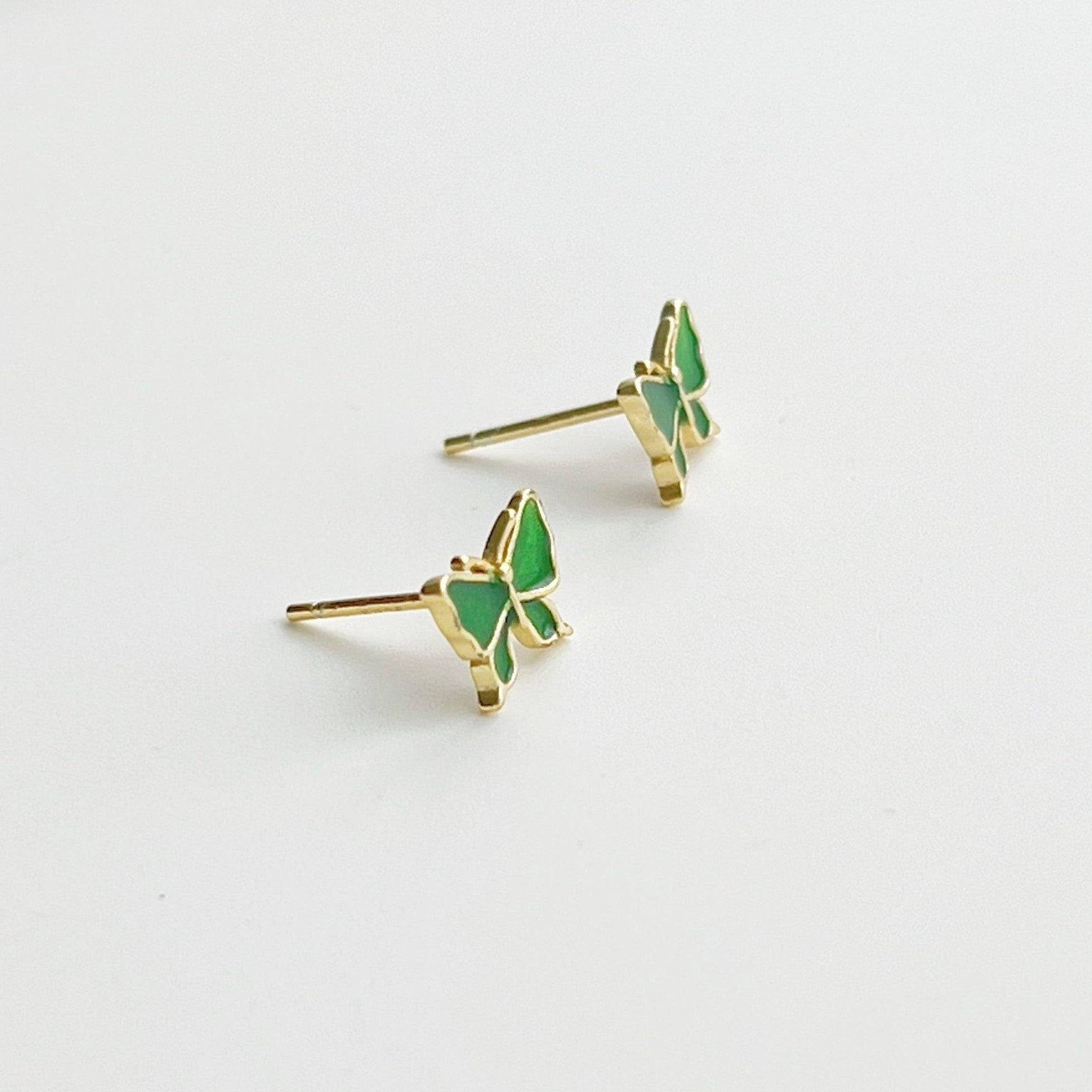 Small emerald green butterfly earrings made from hypoallergenic sterling silver, featuring intricate detailing and a vibrant color.