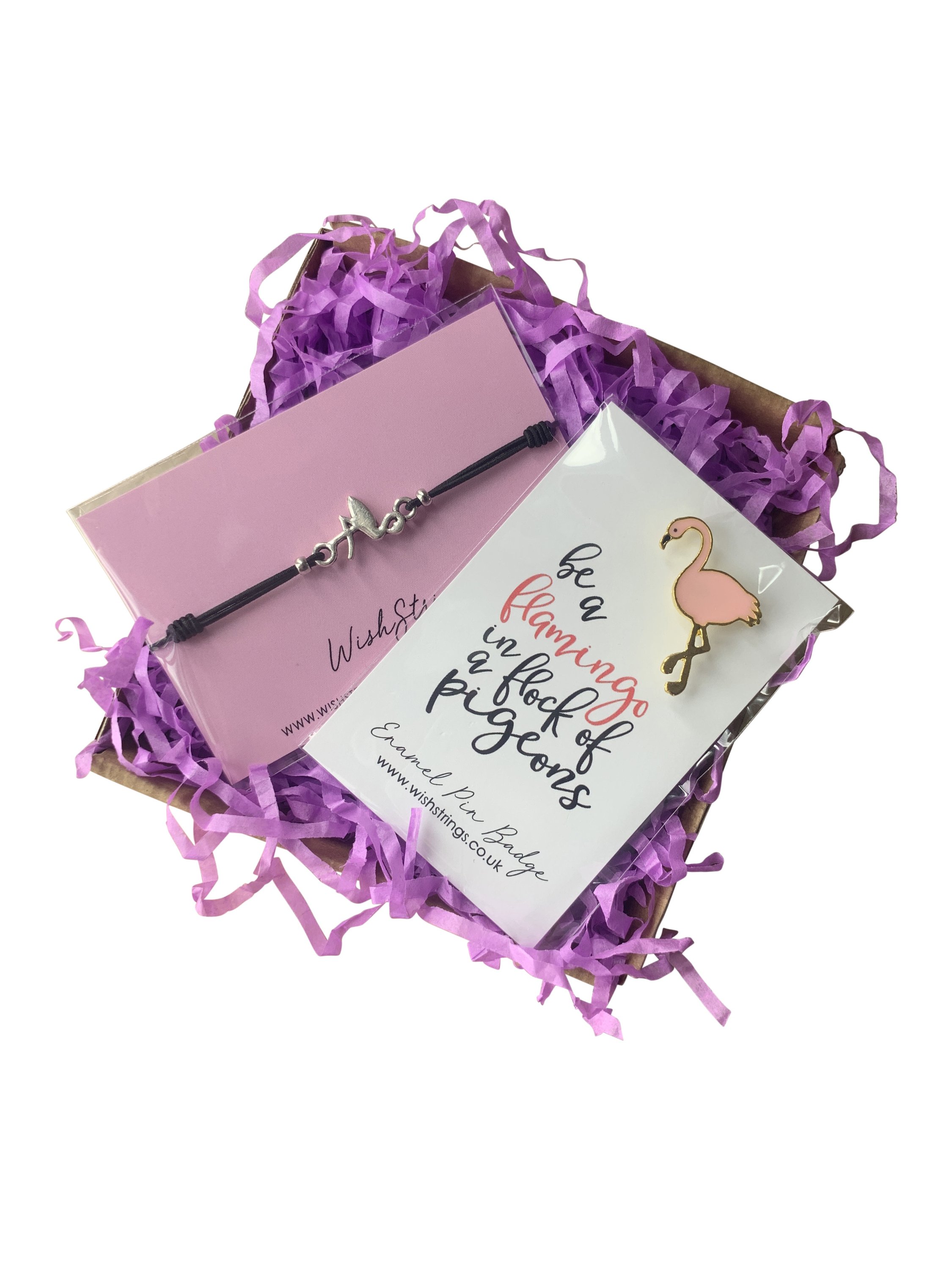 A beautifully arranged Small Flamingo Gift Box containing a wish bracelet and pin badge, perfect for gifting.