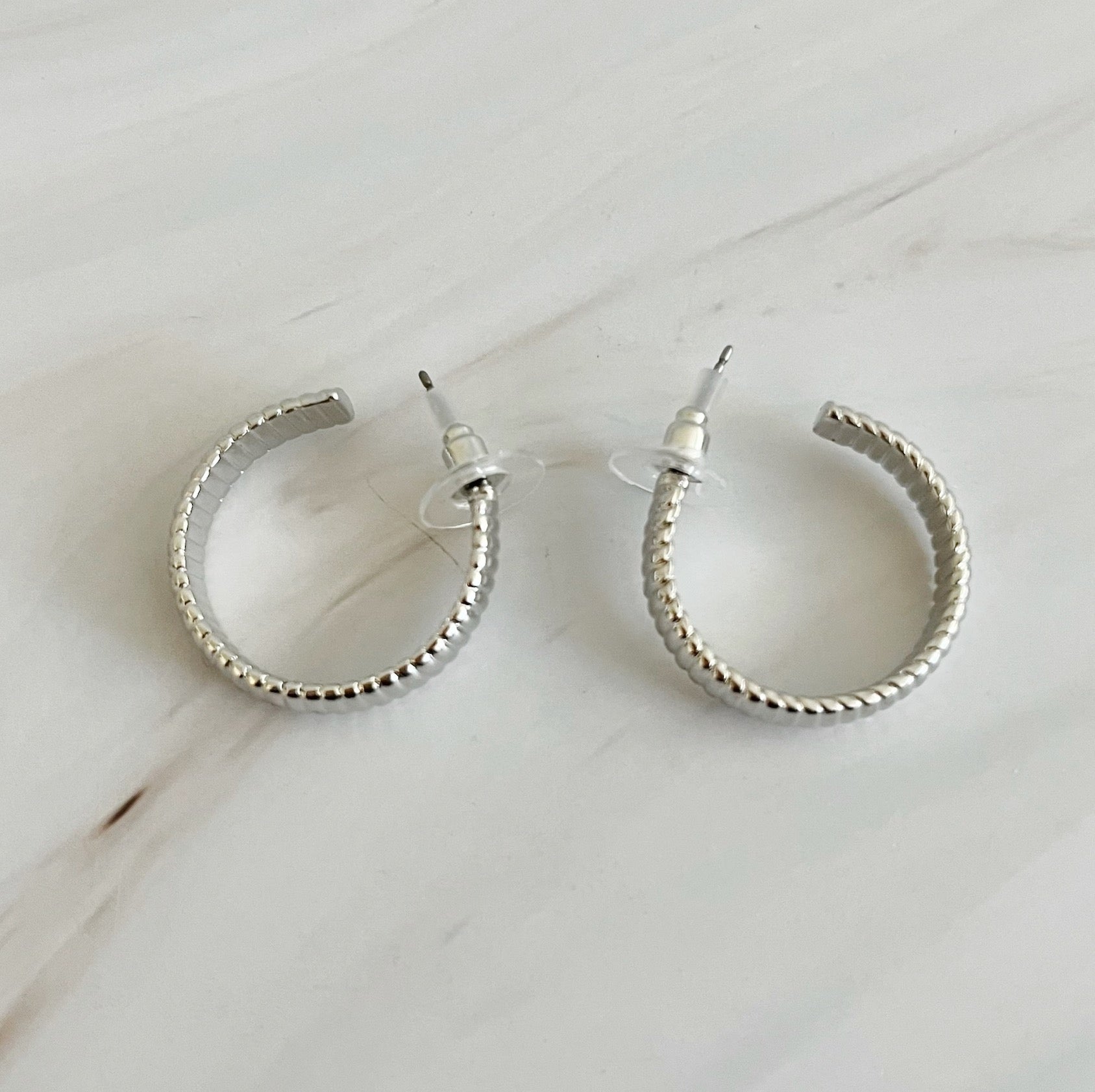 Small Lux Cabled Golden Hoop Earrings featuring a unique cabled design, perfect for adding elegance to any outfit.