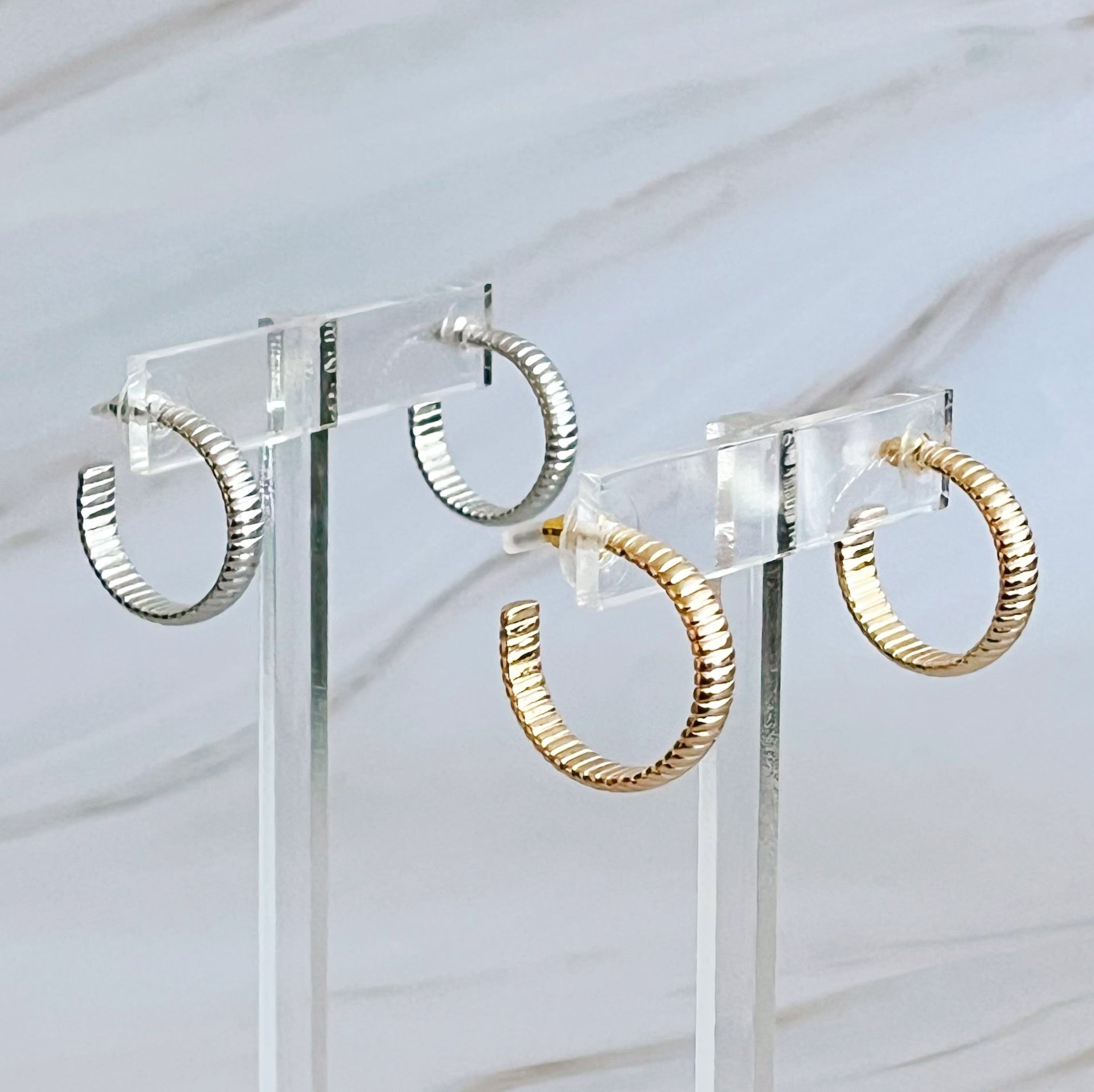 Small Lux Cabled Golden Hoop Earrings featuring a unique cabled design, perfect for adding elegance to any outfit.