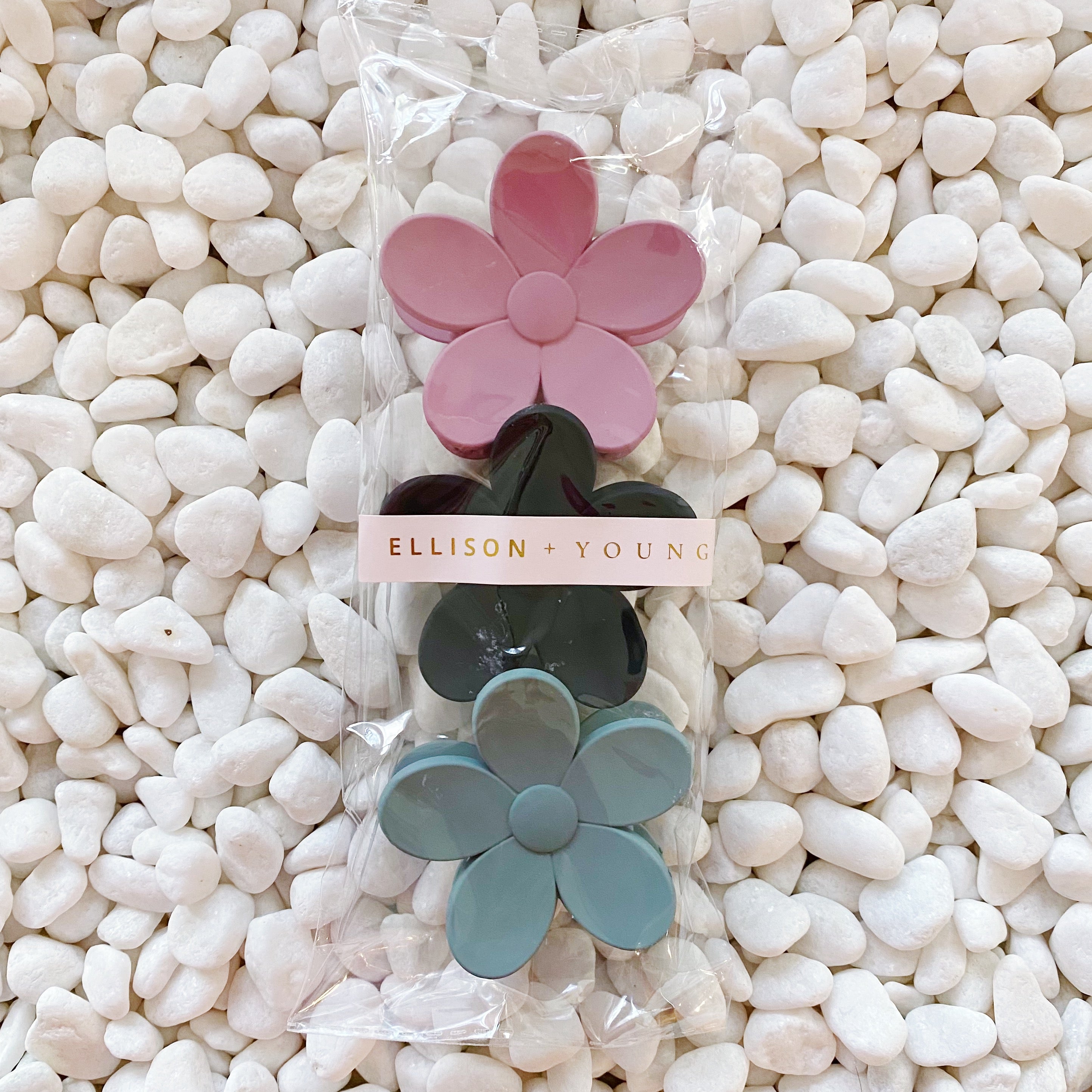 Set of three flower-shaped acrylic hair claws in soft matte finish, showcasing elegant colors for everyday wear.