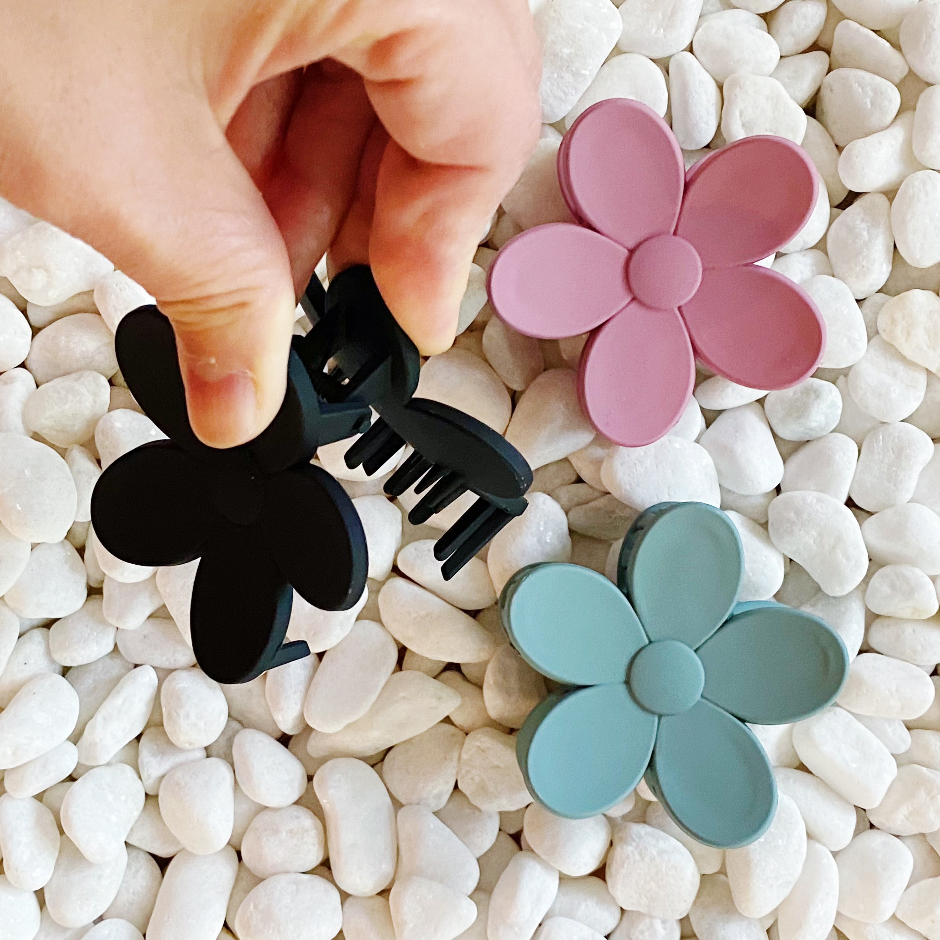 Set of three flower-shaped acrylic hair claws in soft matte finish, showcasing elegant colors for everyday wear.