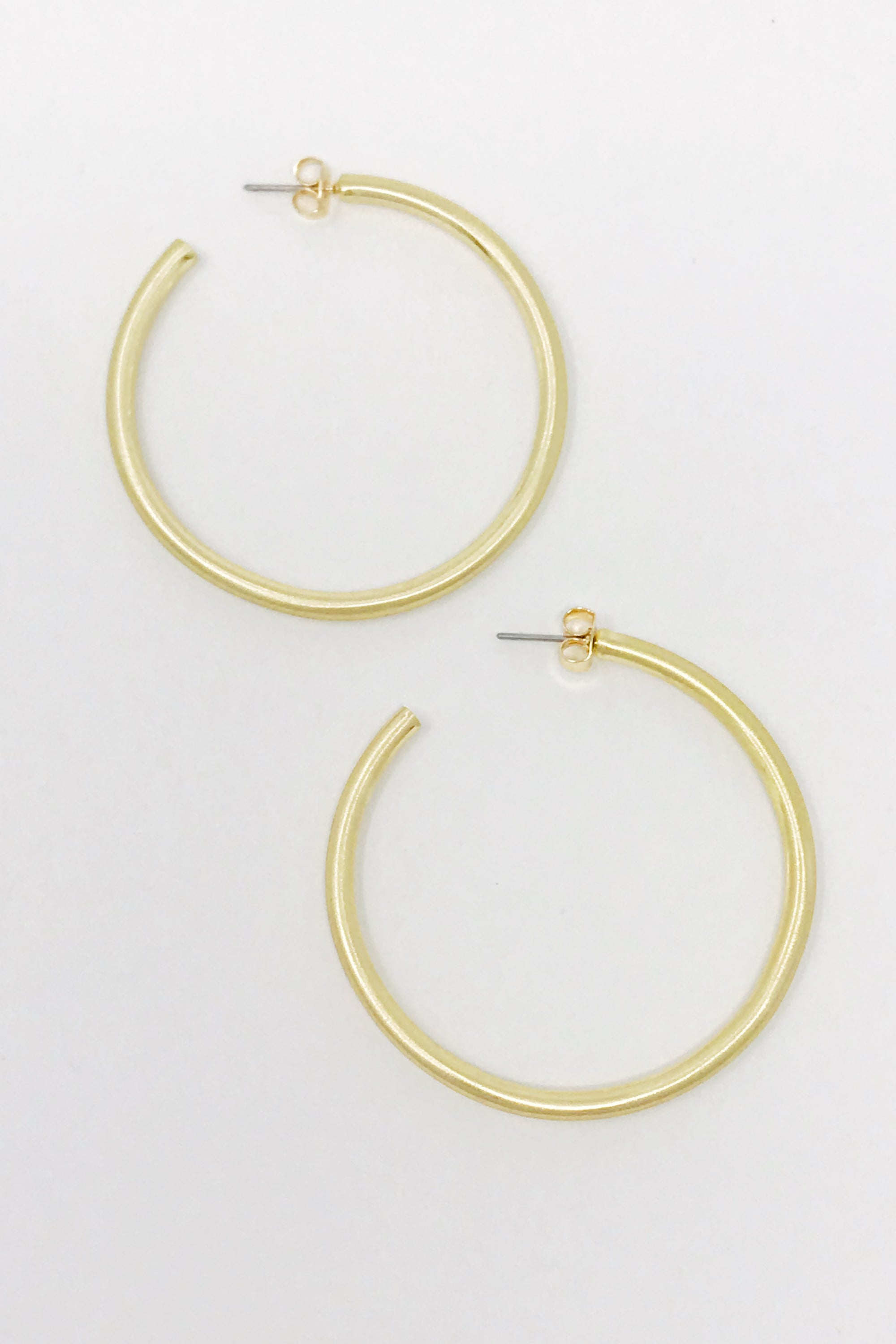 Smaller Jade Satin Finish Hoops, 2-inch diameter, showcasing a smooth satin finish for an elegant look.