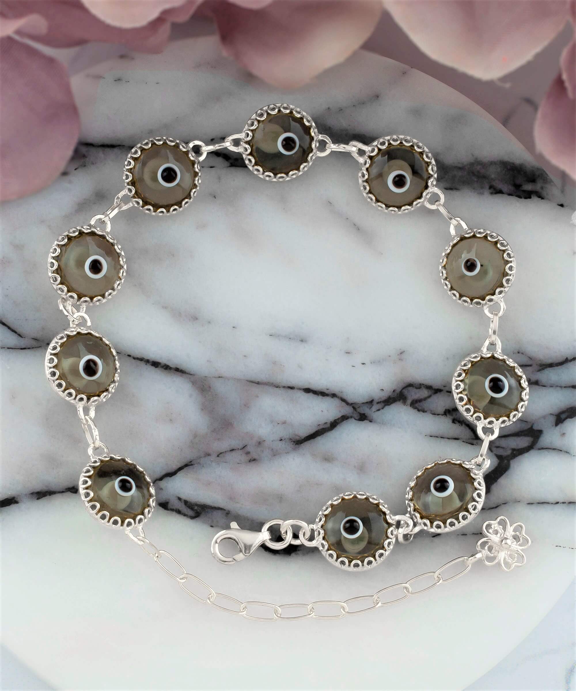 Smokey Evil Eye Woman Sterling Silver Adjustable Link Bracelet featuring a strong rolo chain and ten beads wrapped in silver prongs.