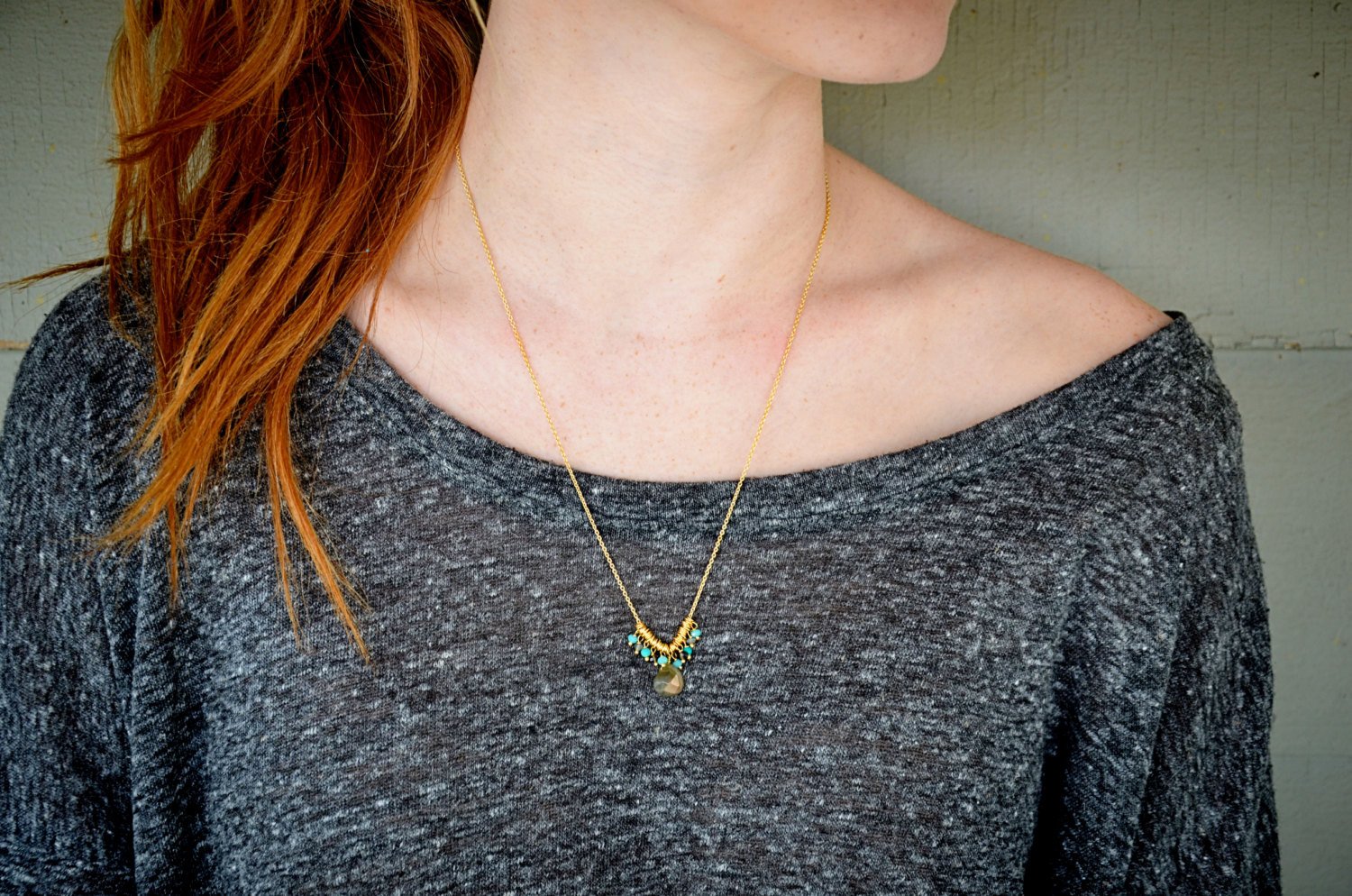 A beautiful Smoky Quartz Drop Necklace featuring a smoky quartz drop and aquamarine petite beads on an 18-inch gold chain.