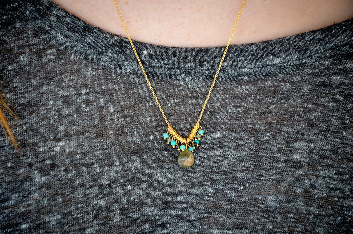 A beautiful Smoky Quartz Drop Necklace featuring a smoky quartz drop and aquamarine petite beads on an 18-inch gold chain.