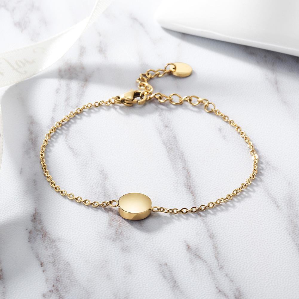 Elegant Smooth Disc Bracelet made of 316L surgical stainless steel with 14K gold PVD plating, showcasing a minimalist design.