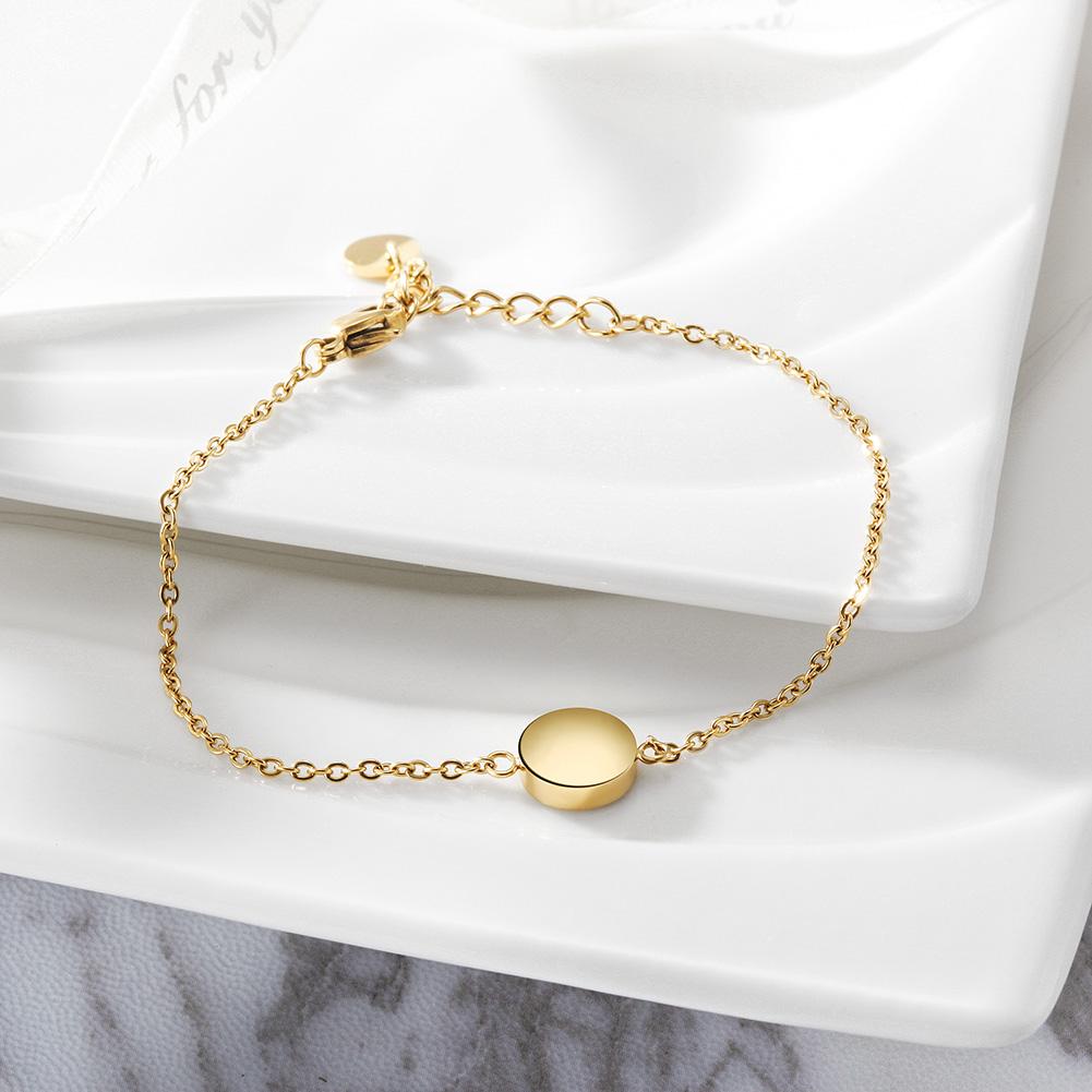 Elegant Smooth Disc Bracelet made of 316L surgical stainless steel with 14K gold PVD plating, showcasing a minimalist design.