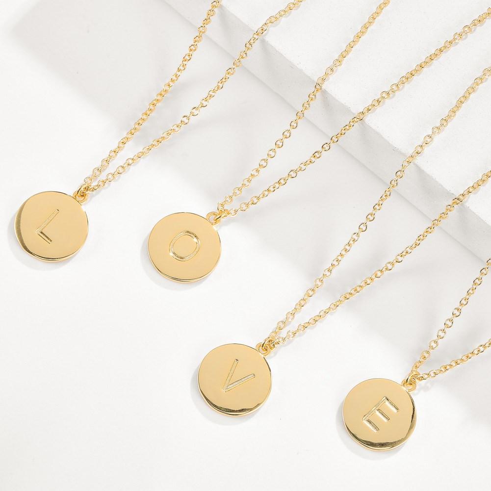 Smooth Disc Initial Necklace in 18K Gold Filled featuring a customizable initial disc, elegant chain, and hypoallergenic design.