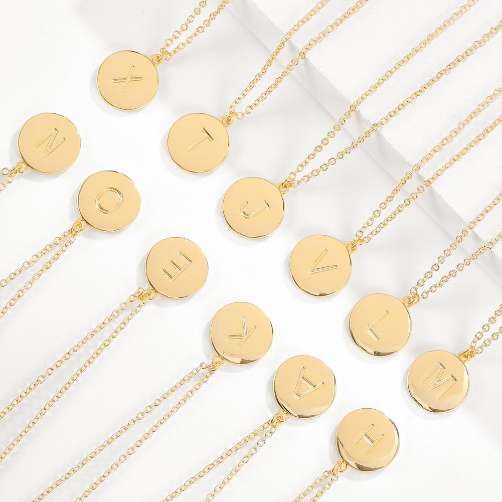 Smooth Disc Initial Necklace in 18K Gold Filled featuring a customizable initial disc, elegant chain, and hypoallergenic design.