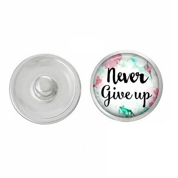 Colorful Never Give Up Snap Jewelry compatible with various snap bases, showcasing vibrant designs and lightweight charm.