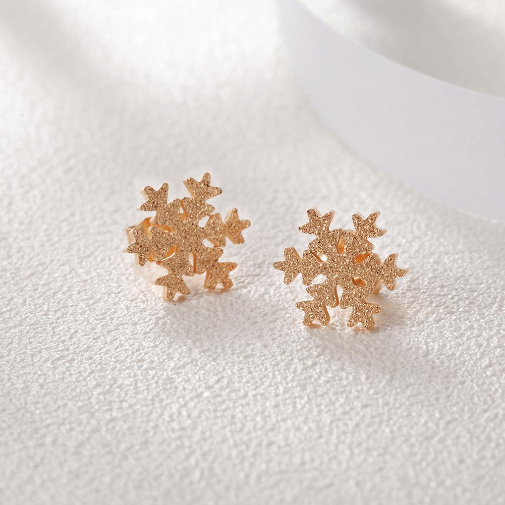 Elegant Snowflake CZ Studs made from hypoallergenic stainless steel with sparkling cubic zirconia.