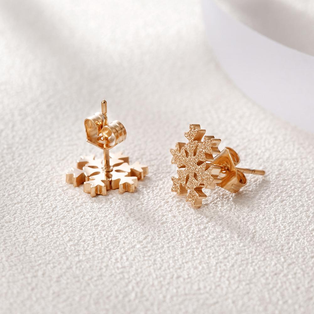 Elegant Snowflake CZ Studs made from hypoallergenic stainless steel with sparkling cubic zirconia.