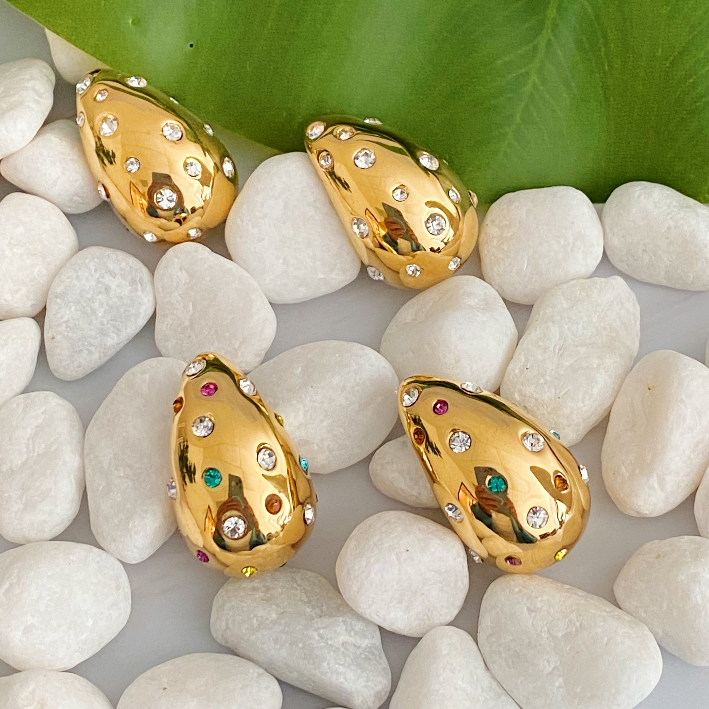 So Chic Jeweled Teardrop Earrings featuring a luxurious teardrop shape with sparkling stones, crafted from 18k gold plated stainless steel.