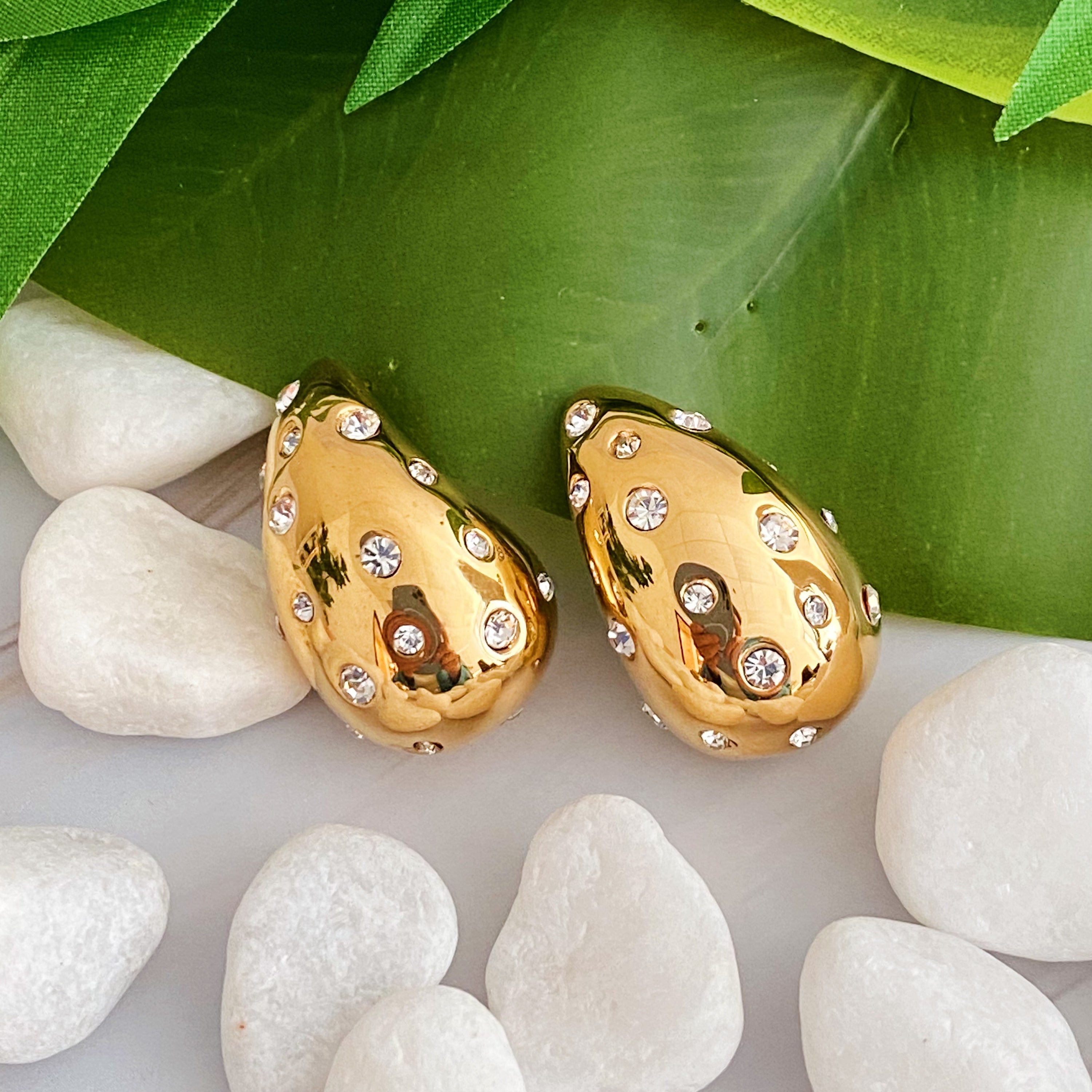 So Chic Jeweled Teardrop Earrings featuring a luxurious teardrop shape with sparkling stones, crafted from 18k gold plated stainless steel.